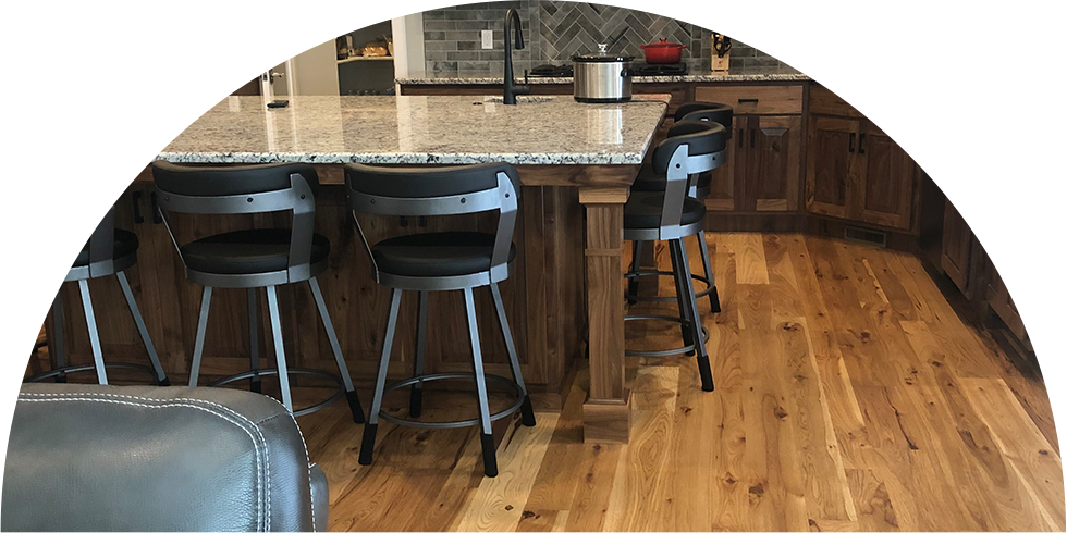 bar stools on a hardwood floor at an island